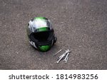 Motorcycle helmet at ground and ...