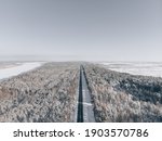 snow road in forest. View at road from sky