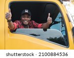 Small photo of professional truck driver delivery worker in transportation and delivery business for long time.Young African American man smiling positive confident thumbs up in truck cargo insurance service.