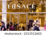 Small photo of Barcelona, Spain-April 29, 2023. Versace, Italian fashion house, based in Milan, Lombardy. Founded by Gianni Versace in 1978 and owned by Michael Kors. Logo on the front door