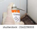 Small photo of Spray chemicals to kill termites in the wall holes, kill termites inside the house