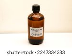 Small photo of hydrochloric acid in bottle , chemical in the laboratory and industry, Chemical used in the analysis