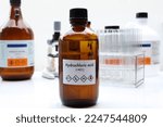Small photo of hydrochloric acid in bottle , chemical in the laboratory and industry, Chemical used in the analysis