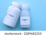 Small photo of Prednisone pill in white bottle, pill stock, medical or pharmacy concept