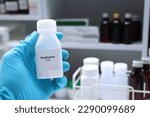 Small photo of Prednisone pill in white bottle, pill stock, medical or pharmacy concept