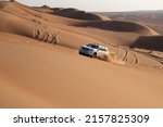 Small photo of 4x4 vehicle dune bashing in Sharqiya Sands desert in Oman. 26 November 2021.