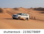 Small photo of 4x4 vehicle dune bashing in Sharqiya Sands desert in Oman. 26 November 2021.