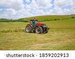 Tractor Turning Cut Grass To...