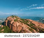 drone shot aerial view top angle panoramic photograph of hill cliff mountain rugged trekking trail hiking forest hilly rugged terrain landscape tourism hindu temple madurai india thirupuramkundram 