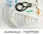Medical equipment for airway management : stethoscope, syringe, oral airway and endotracheal tube on white background                        
