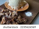 Small photo of Close up photo of nyama choma-Grilled goat meat- and Ugali - corn meal. A popular dish in East Africa, particularly Kenya and Tanzania, where it's regarded as national dish. Selective focus.