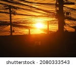 Small photo of A photograph of a zealot light against a background of cluttered wires.