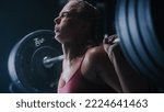 Small photo of Portrait of Strong Sports Woman Overcoming the Workout Pain to Improve Her Physical Endurance. A Determined Female Athlete Trying To Beat her Personal Record by Training and Exercising. Close Up Shot