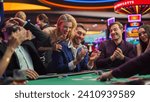 Small photo of Intense Win in a Poker Game on a Casino Floor Championship. Handsome Man Has Stronger Hand and Beats Opponents with His Card Deal. Triumphant WInner Shaking Hands and Celebrating