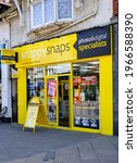 Small photo of " Staines upon Thames, MiddlesexUnited Kingdom-04 26 2021: The frontage of Snappy Snaps which is located at Staines upon Thames High Street in Middlesex"