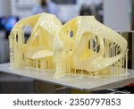Small photo of Printed models on 3D printer close-up. Objects printed on photopolymer sla 3D printer from liquid photopolymer resins on printing platform. Modern progressive additive technology. 3D printer printing