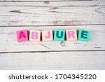 Small photo of "abjure"-the words on wooden cubes. A background image of english words on colorful building blocks.
