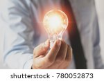 businessman hand holding light bulb. idea concept with innovation and inspiration