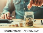 businessman holding coins putting in glass. concept saving money for finance accounting
