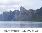Captivating senja: majestic segla mountain summit offering breathtaking nordic landscapes, a panoramic view of rocky wilderness and fjords in northern norway's idyllic outdoor playground.