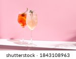 Aperol Spritz Cocktail on pink background. Sunlight and shadow background. Pink and white minimal
