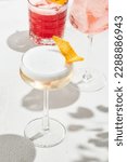 Small photo of Classic cocktail - pisco sour with egg foam on elegant glass. Pisco sour on white background with shadows. Lifestyle summer drink menu. Sour cocktail with citrus and foam. Aesthetic alcohol drink