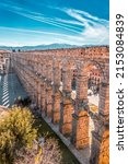 Small photo of Segovia, Spain - February 18, 2022: The ancient Roman aqueduct of Segovia, one of the best-preserved elevated Roman aqueducts and the foremost symbol of Segovia.