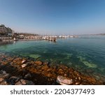 Small photo of Geneva, Switzerland - 25 March 2022: Scenic view from the Geneva Lake at the Bay of Geneva, the French section of Switzerland.
