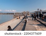 Small photo of Geneva, Switzerland - 25 March 2022: People enjoying the scenic view of the Geneva Lake at the Bay of Geneva, the French section of Switzerland.