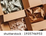 Cardboard boxes with crumpled paper inside for packaging goods from online stores, eco friendly packaging made of recyclable raw materials