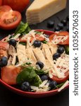 Small photo of Fresh Salad with Chicken, Tomatoes Blueberries and Parmesean Cheese