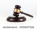 a wooden judge gavel and soundboard  on white background.