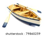 Wooden boat with paddles isolated over white