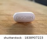Small photo of Digoxin pill medication used to treat heart conditions in cardiology such as atrial fibrillation, atrial flutter and heart failure