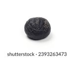 Close-up image of a smal burger bun naturally colored with activated charcoal sprinkled with poppy seeds, isolated on white background