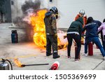 Small photo of Firemen using extinguisher and water for fight fire during firef. September12, 2019 Nakhon Ratchasima, Thailand