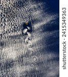 Small photo of Vortex street off Revillagigedo Archipelago, North Pacific afternoon overpass. Vortex street off Revillagigedo Archipelago, North Pacific. Elements of this image furnished by NASA.
