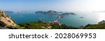 High angle and panoramic view of Seonyudo and Jangjado Islands with a bridge on the sea near Gunsan-si, South Korea 
