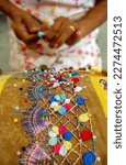 Small photo of Handmade bobbin lace from northeast Brazil on August 08, 2003. Craftswoman's hands in close-up with blurred background. Brazilian crafts