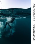 Small photo of Free Diver jumping off the dive boat into Lake Huron