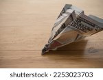 US dollar banknote plane crash on wooden table background copy space. Hard landing economy, recession economic, global world economic crisis due to inflation or FED control interest rates concept.