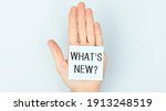 what's new  card in hand with... | Shutterstock . vector #1913248519