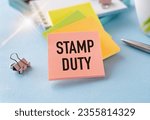 Stamp Duty not reactive on white paper book on table, business concept