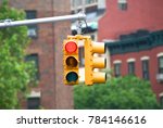 Red color traffic light with buildings in the background. Traffic light wallpaper.