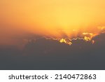 bright sunset or sunrise sky with clouds and sunrays
