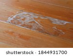 Small photo of Old flooring degraded by moisture.