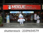 Small photo of Bangkok, Thailand - July 16, 2023: Snow King A Mascot of Mixue Chinese Ice Cream and Tea Store at Siam Square Shopping District.