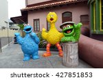 Small photo of SINGAPORE - 06 MAY 2016: Cookie Monster, Big Bird and Oscar the Grouch Model at Universal Studios