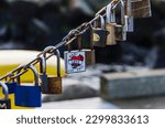 Small photo of Sopot, Poland - 01 19 2020: many locks on a chain, Sopot embankment, Sopot pier, locks with autographs left by tourists