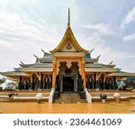 Small photo of a temple is viewed from the outside of it, in the style of dark green and light bronze, cobra, luxurious, colorful, purism, light pink and light orange, texture rich